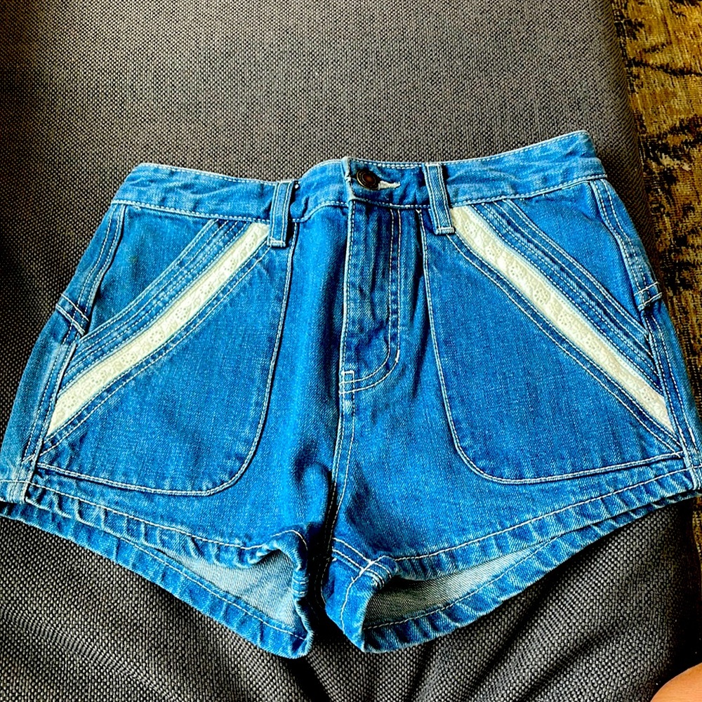 Free people denim shorts with lace detail